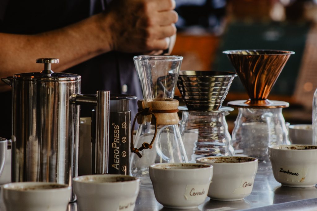 Photo of man making coffee using a Chemex pot